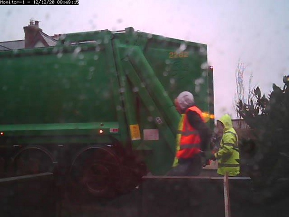 Image of bin men and a dust cart.