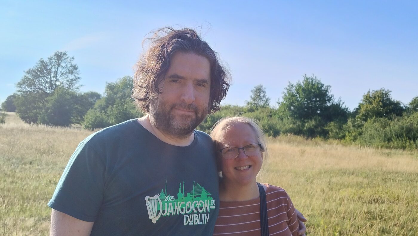 Zeth and Jutta standing together in a sunny meadow
